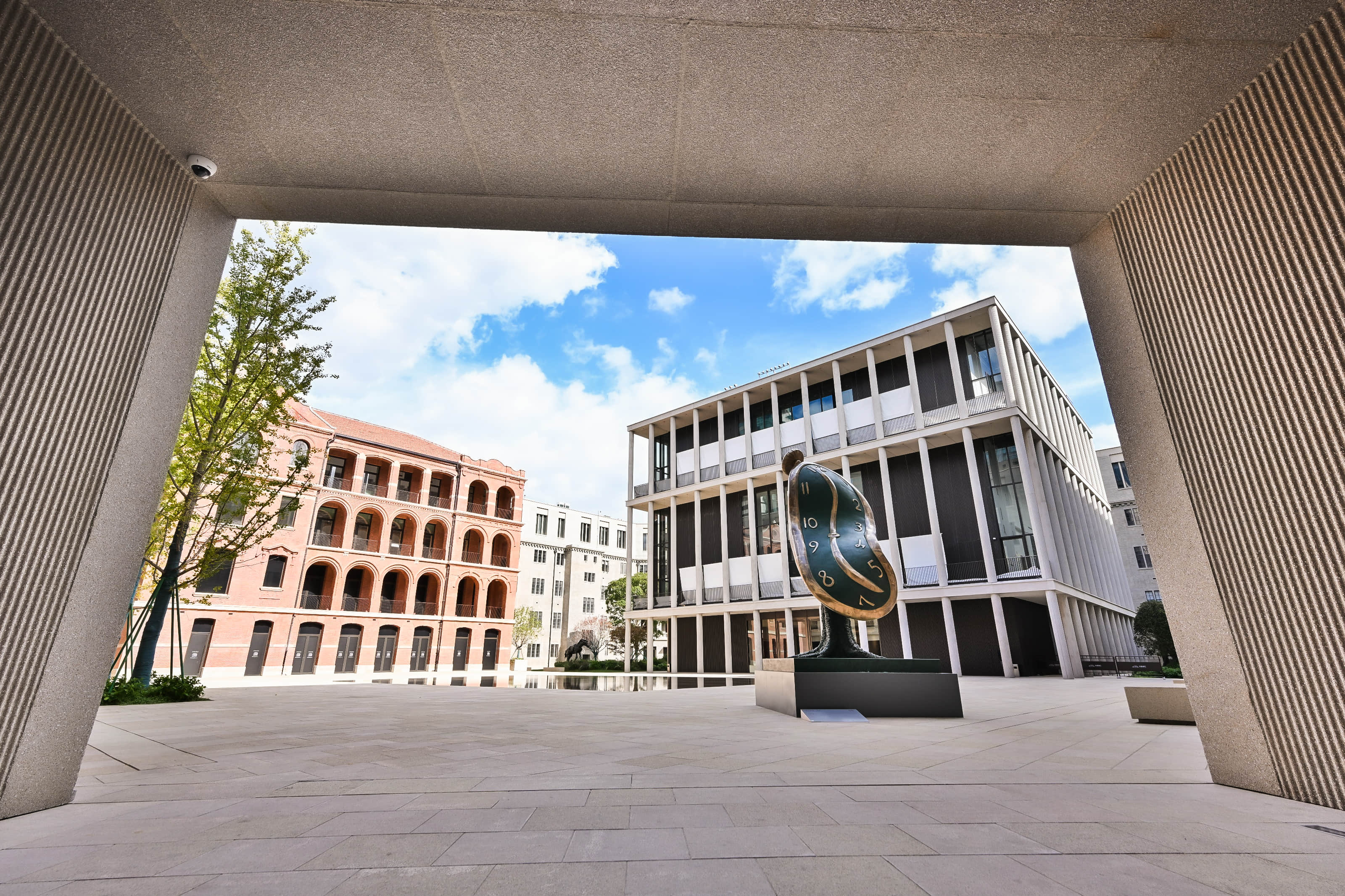 High-resolution panoramic project photo showing the Dalí exhibition venue and outdoor horse sculpture in Shanghai